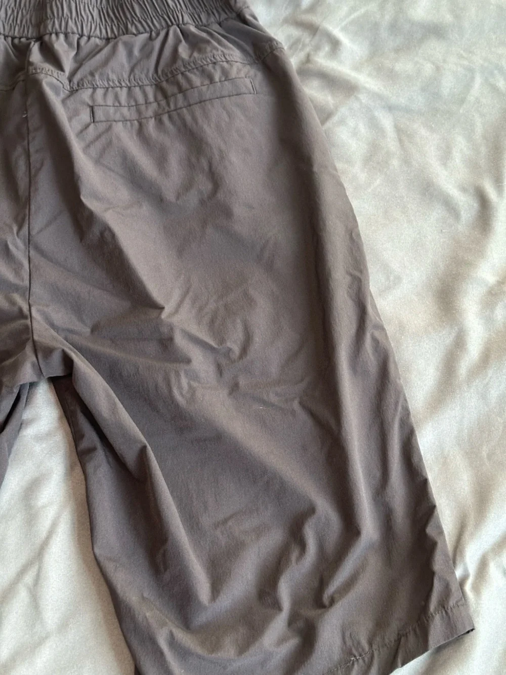 Black long nylon tech shorts, size M/L
